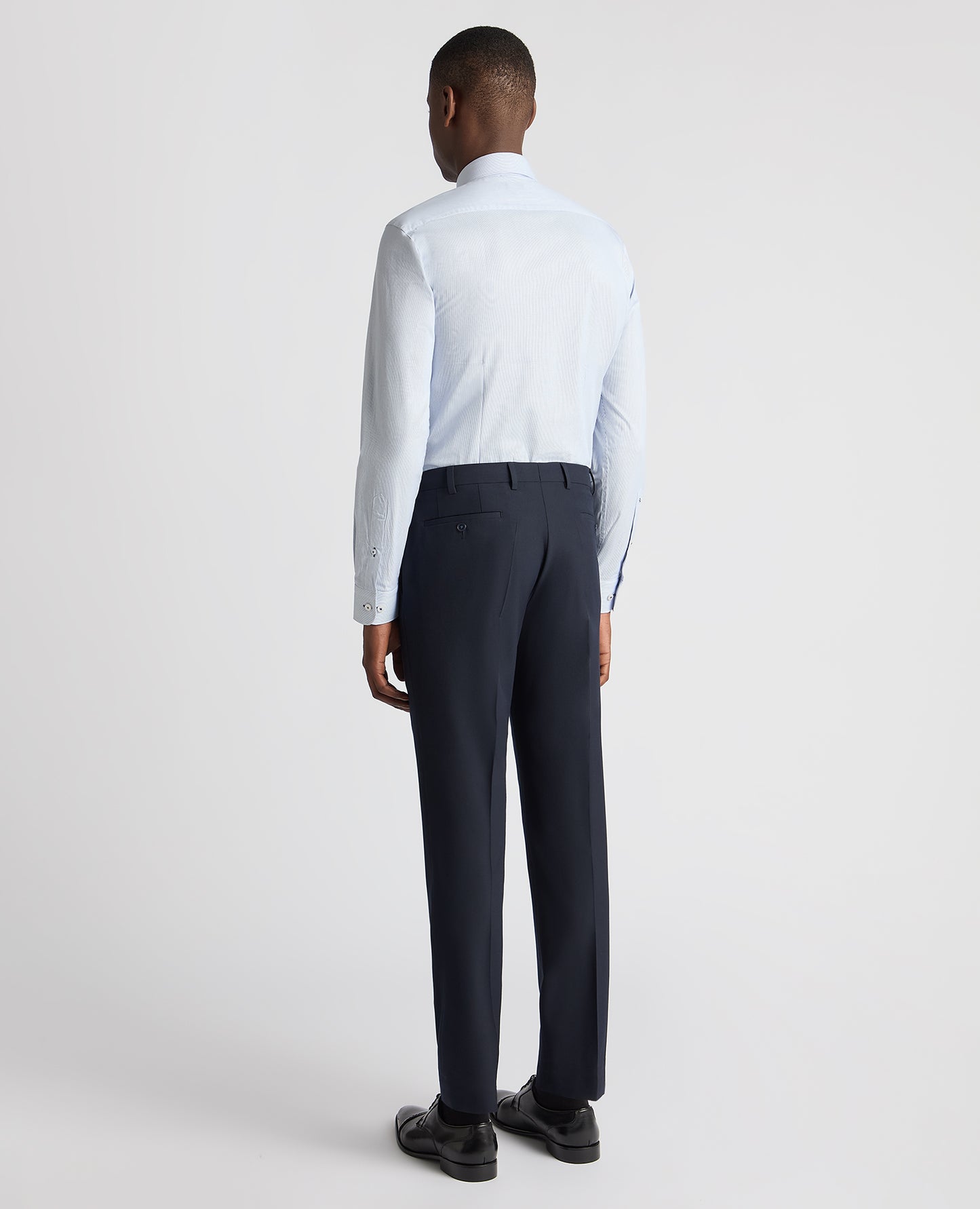 Man wearing a blue Tapered Fit Cotton Stretch Pinstripe Shirt