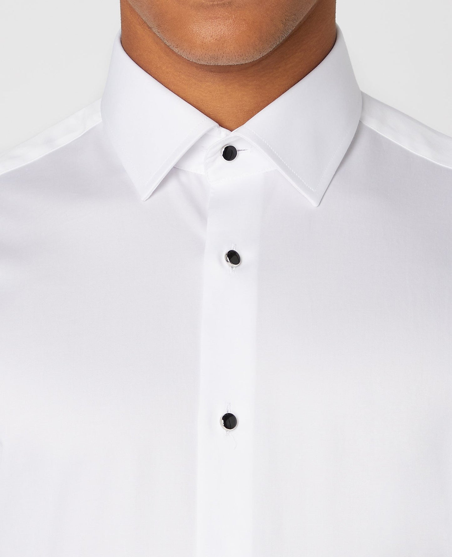 Man wearing a white Tapered Fit Cotton Evening Shirt