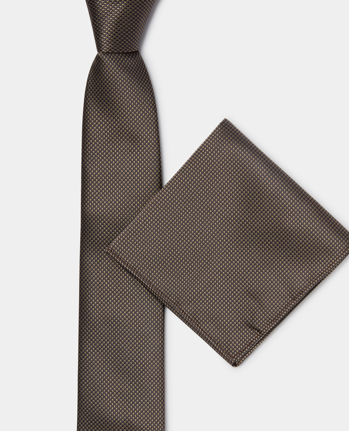 Man wearing a brown Abstract Polka Dot Tie