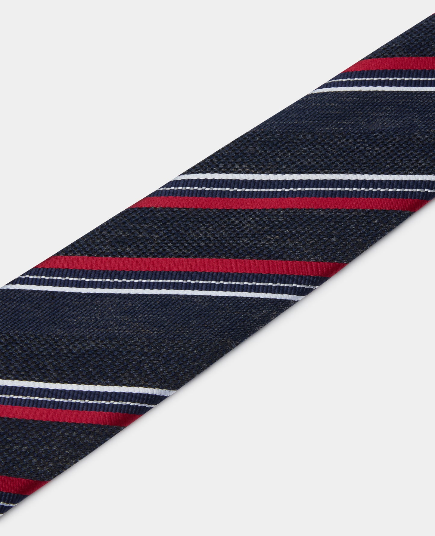 Man wearing a navy Stripe Design Tie