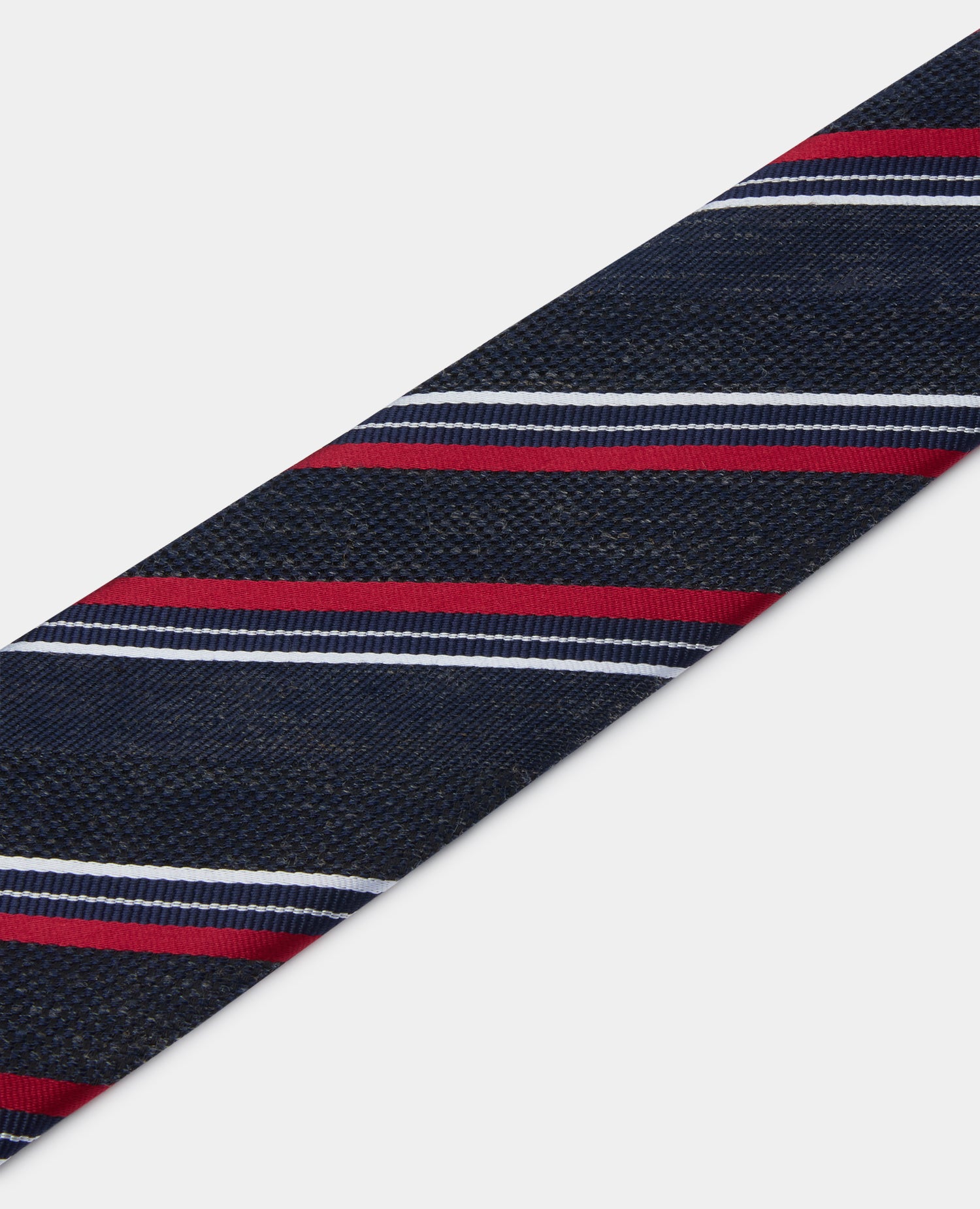 Man wearing a navy Stripe Design Tie