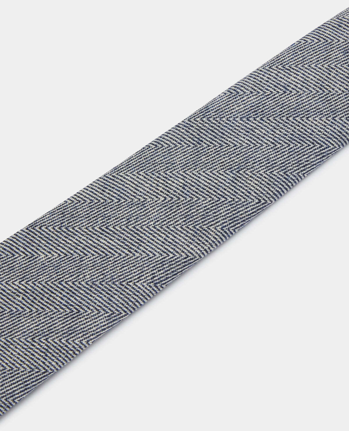 Man wearing a navy Herringbone Design Tie