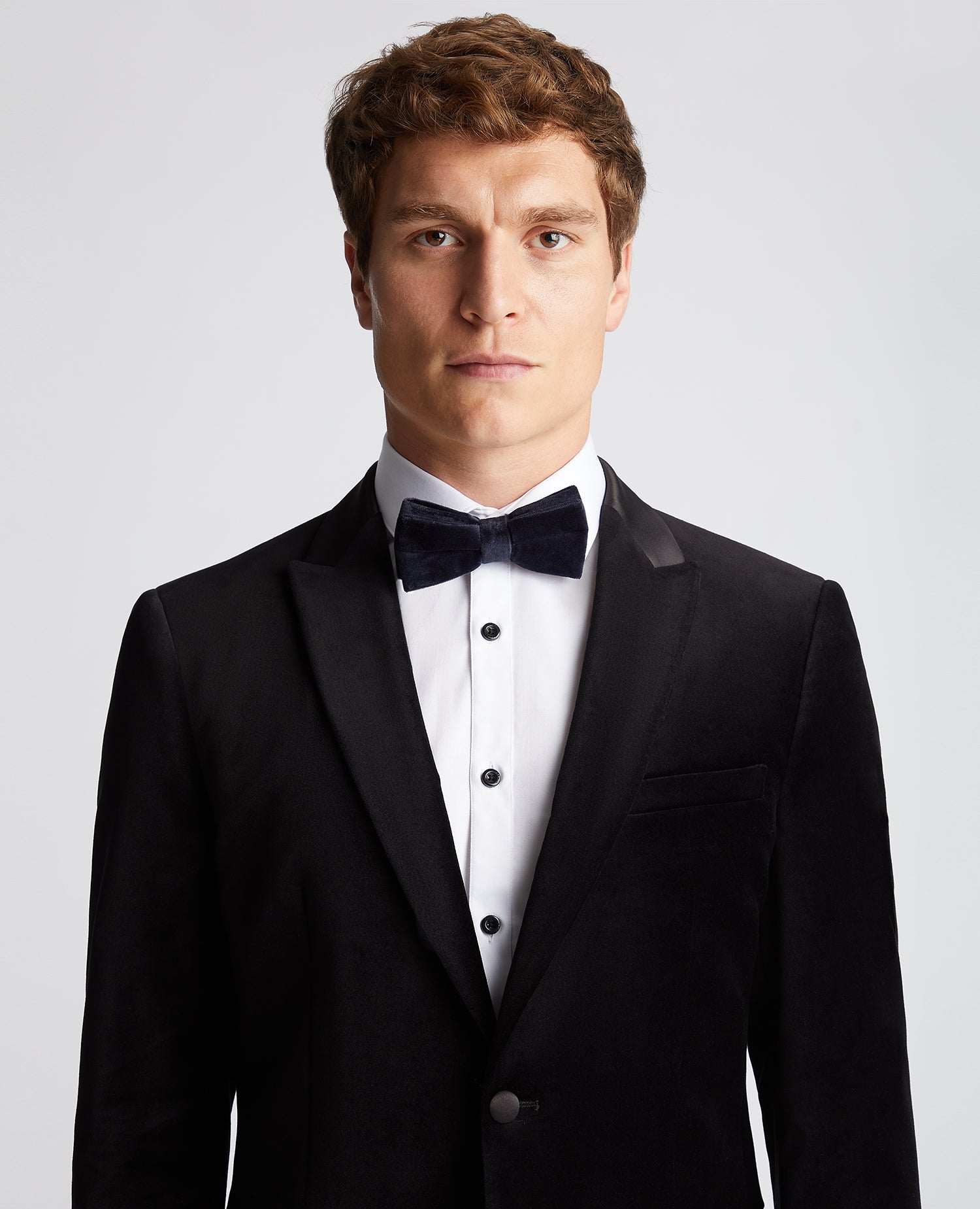 Man wearing a navy Velvet Bow Tie