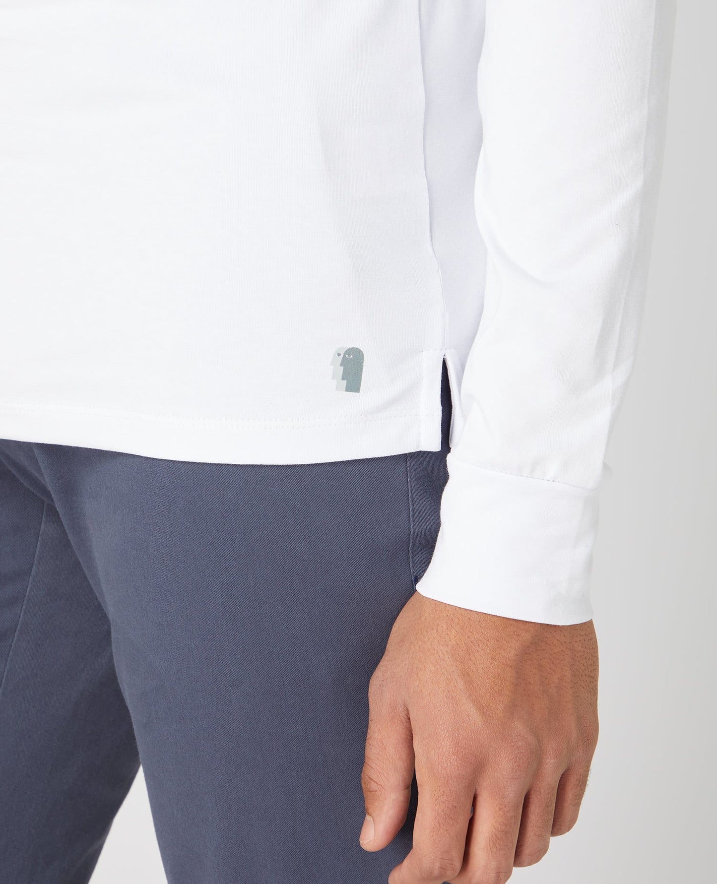 Man wearing a white Tapered Fit Cotton-Stretch Long Sleeve T-Shirt