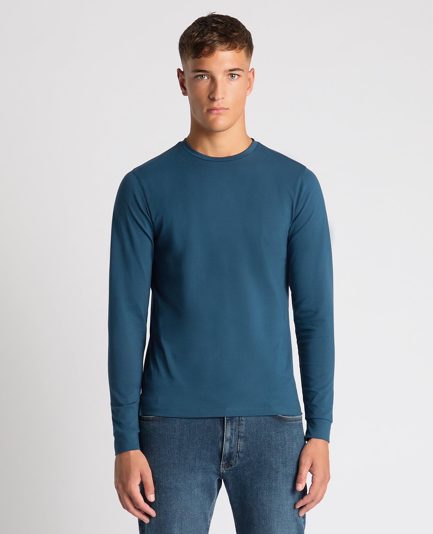 Man wearing a blue Tapered Fit Cotton-Stretch T-Shirt