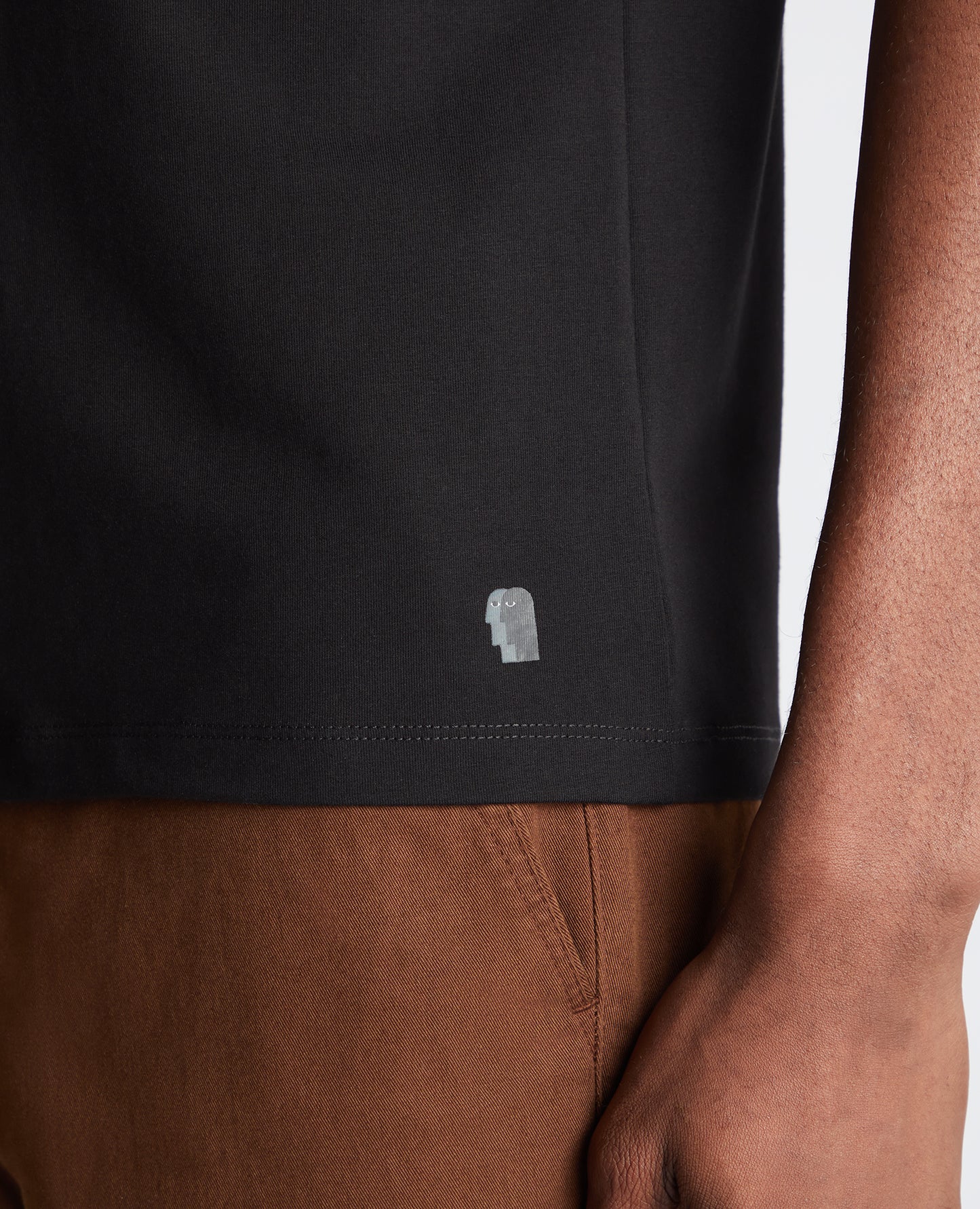 Man wearing a black Tapered Fit Cotton-Stretch T-Shirt