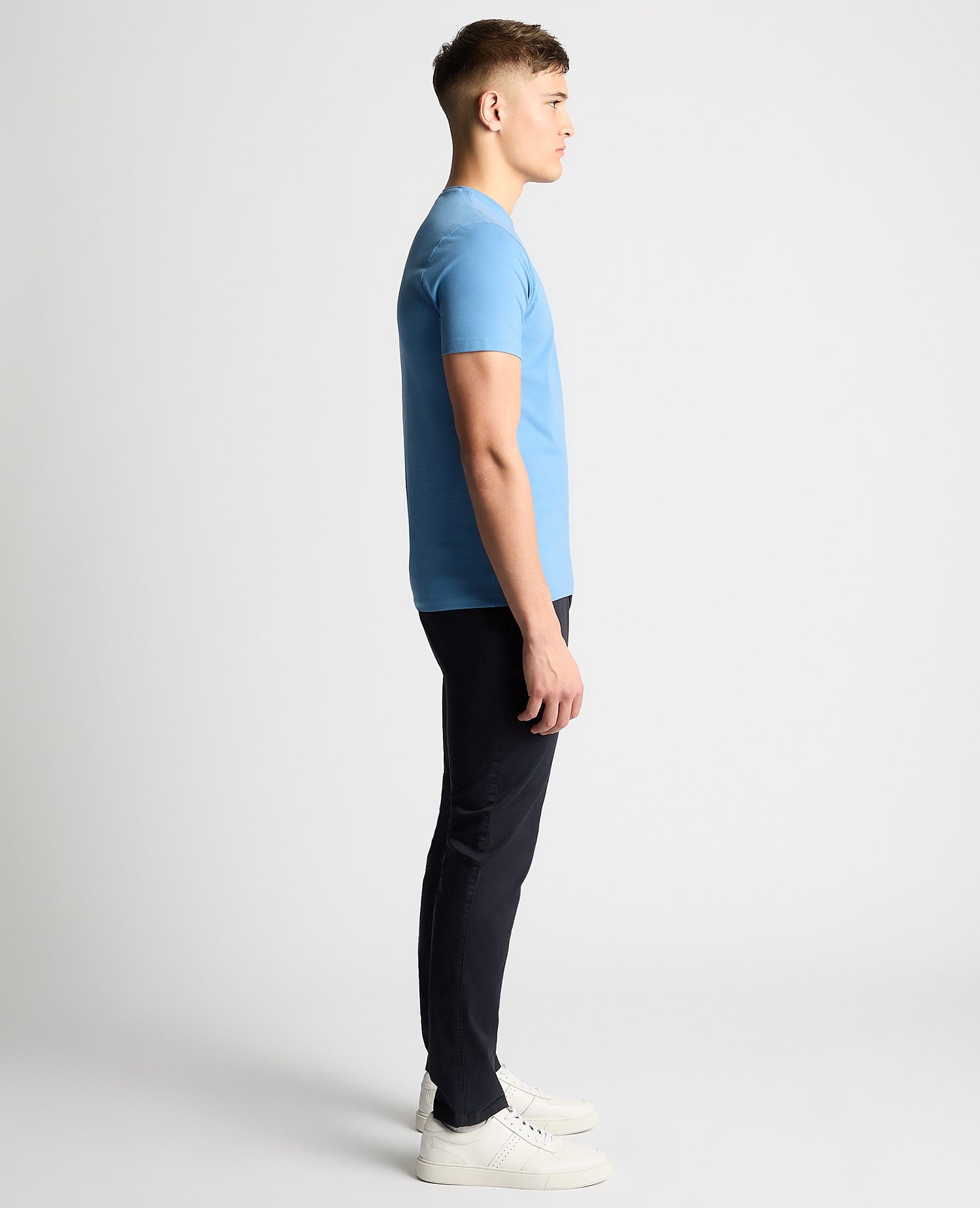 Man wearing a blue Tapered Fit Cotton-Stretch T-Shirt