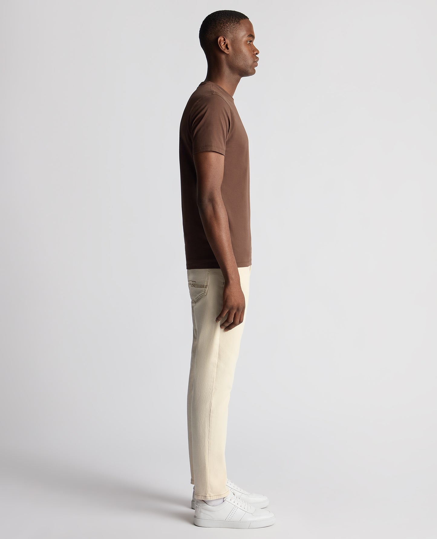 Man wearing a brown Tapered Fit Cotton-Stretch T-Shirt