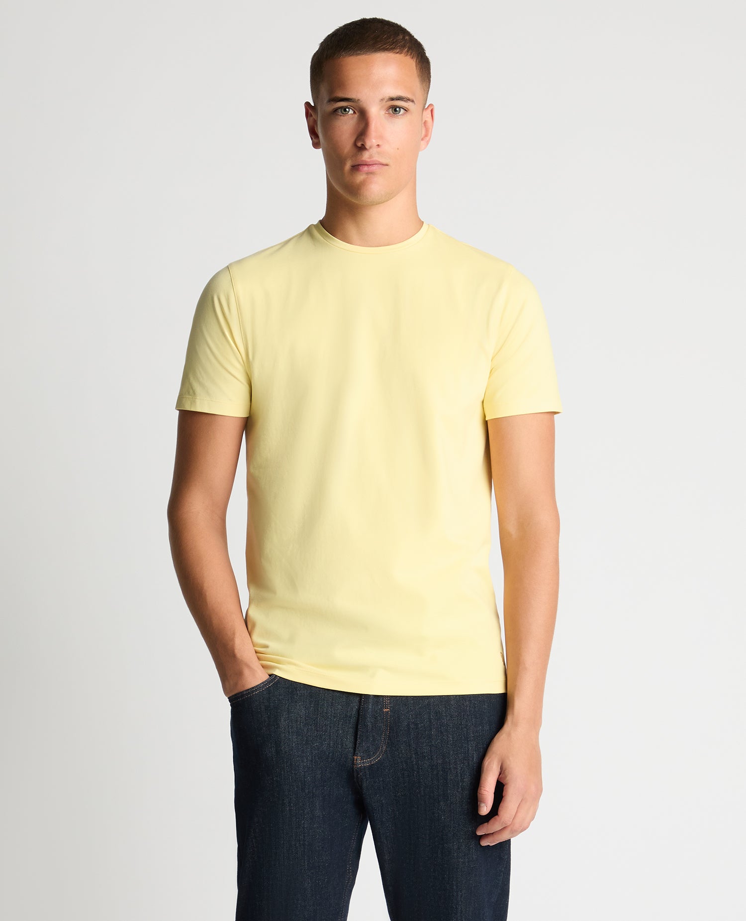 Man wearing a orange Tapered Fit Cotton-Stretch T-Shirt