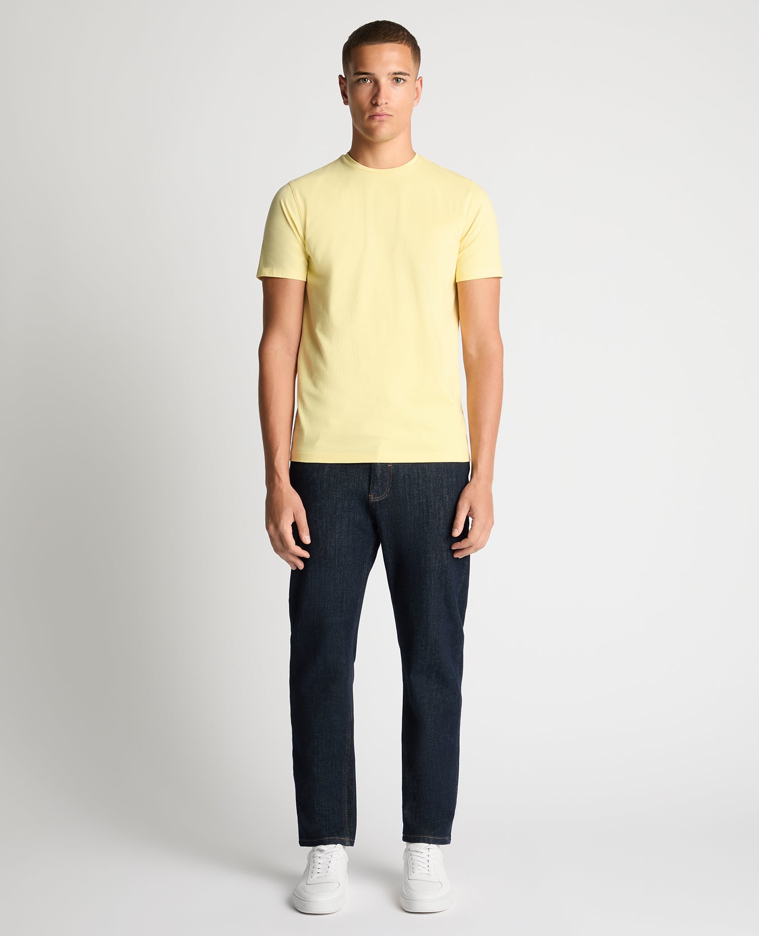 Man wearing a orange Tapered Fit Cotton-Stretch T-Shirt