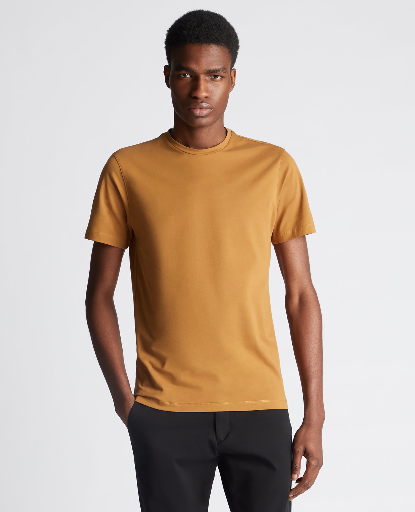 Man wearing a orange Tapered Fit Cotton-Stretch T-Shirt