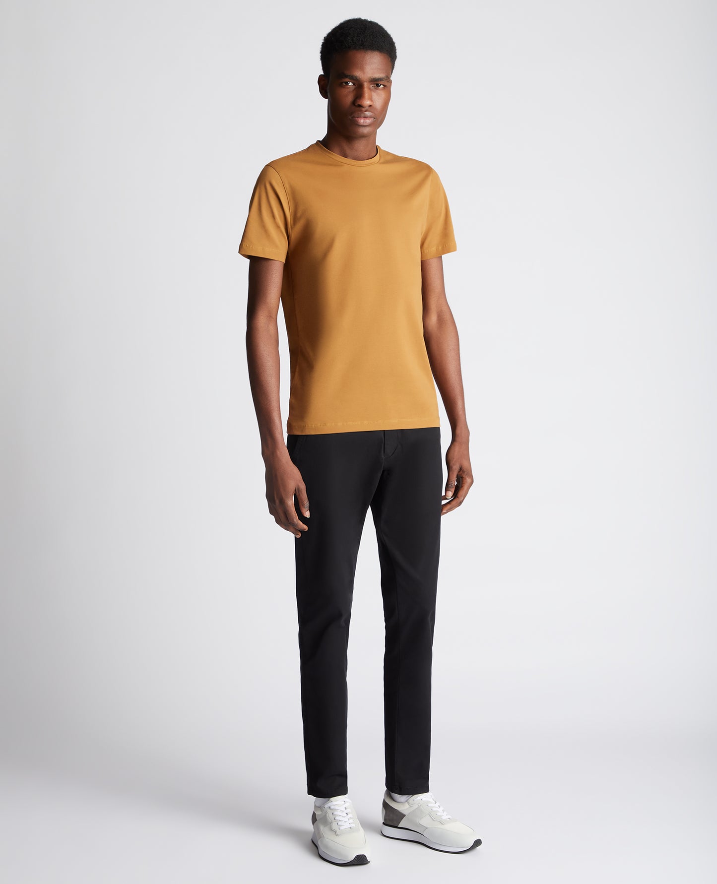 Man wearing a orange Tapered Fit Cotton-Stretch T-Shirt