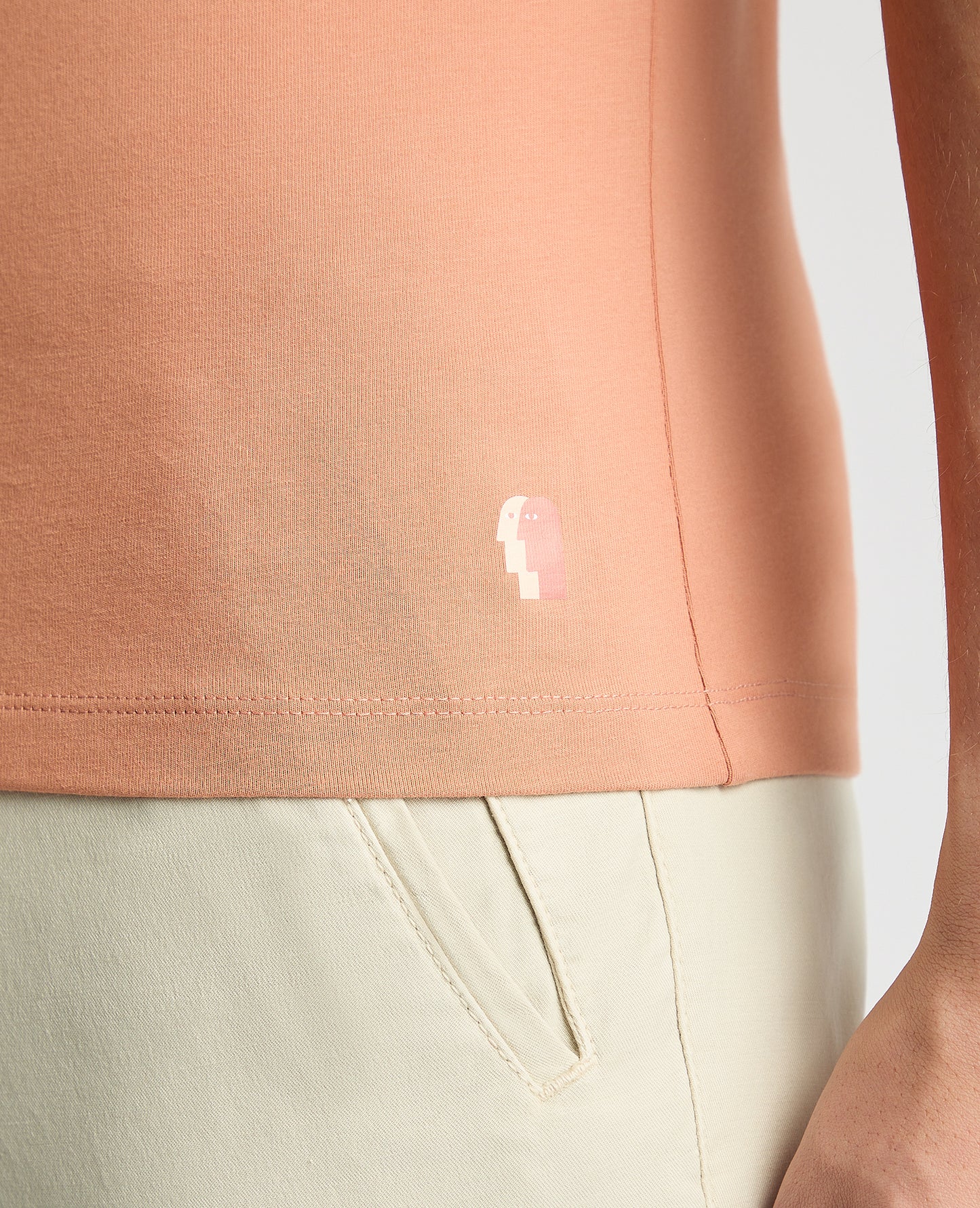 Man wearing a red Tapered Fit Cotton-Stretch T-Shirt