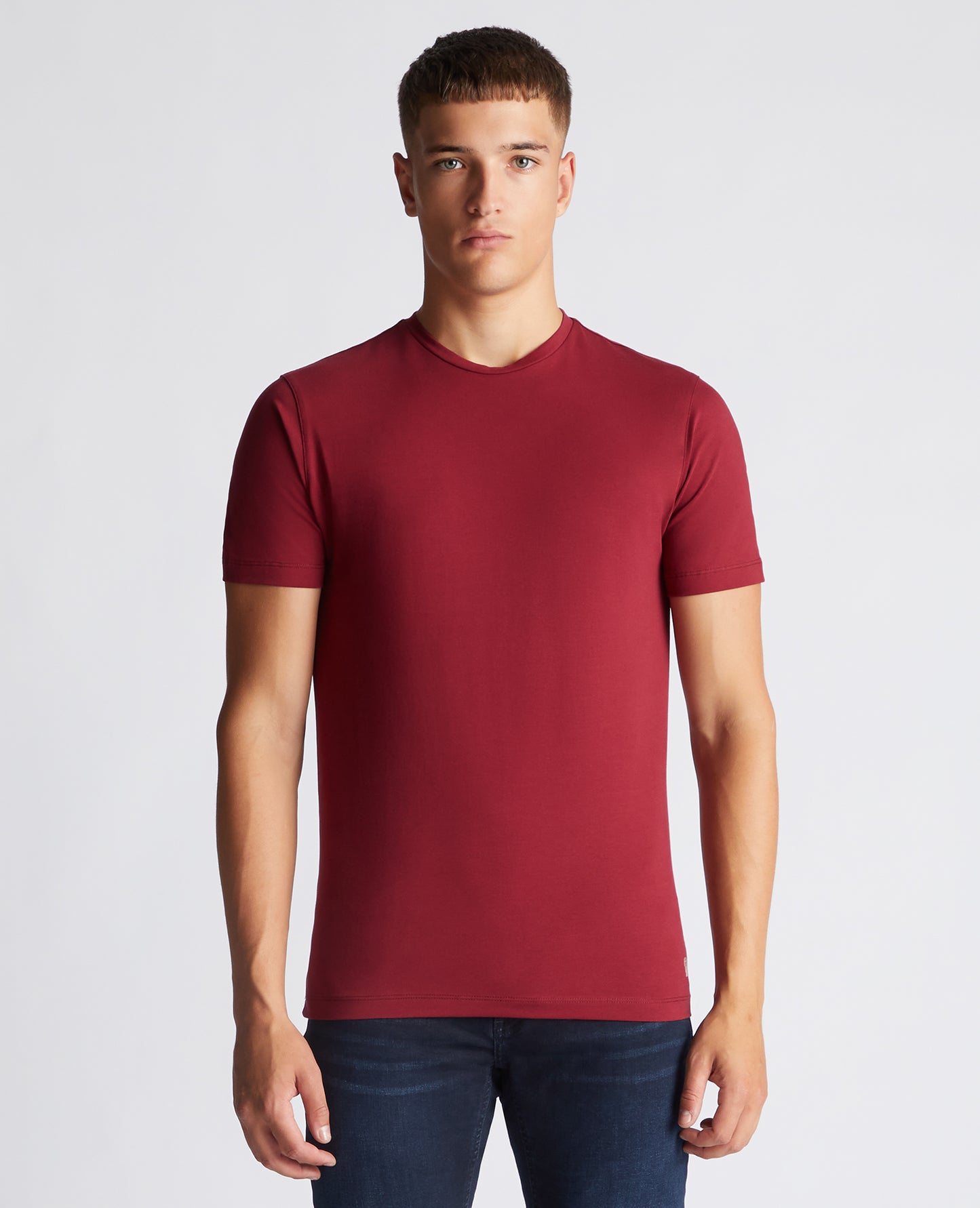 Man wearing a red Tapered Fit Cotton-Stretch T-Shirt