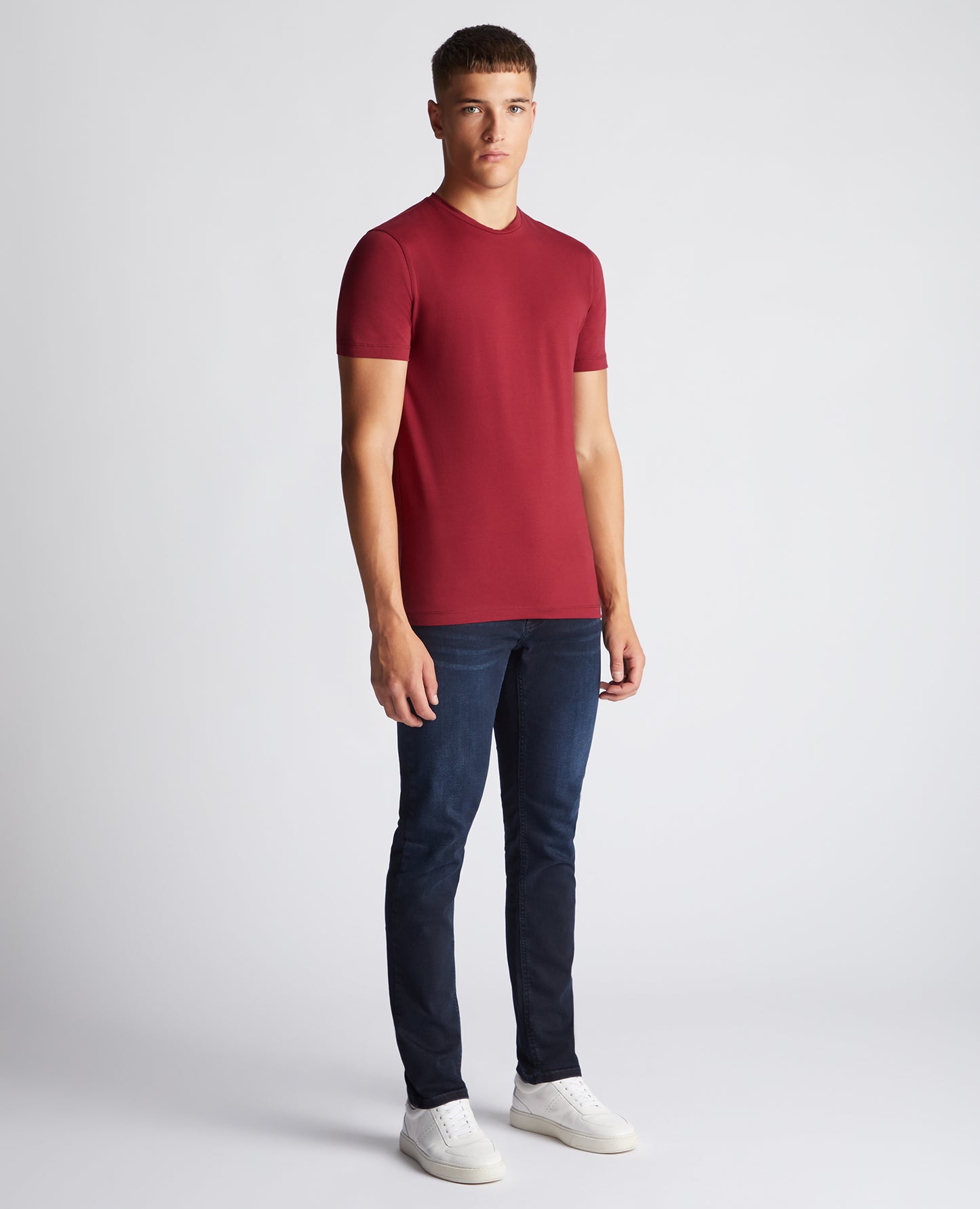 Man wearing a red Tapered Fit Cotton-Stretch T-Shirt