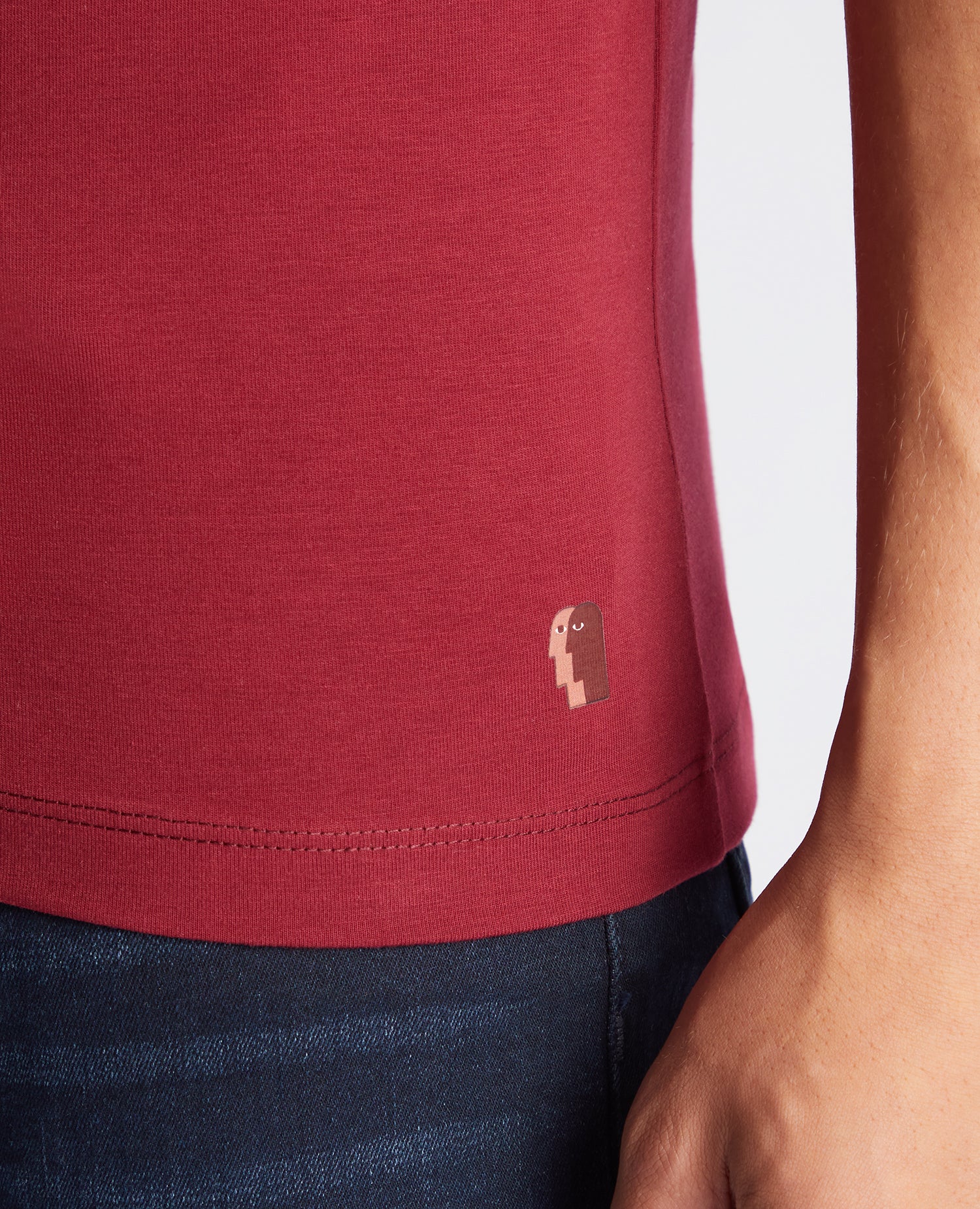 Man wearing a red Tapered Fit Cotton-Stretch T-Shirt