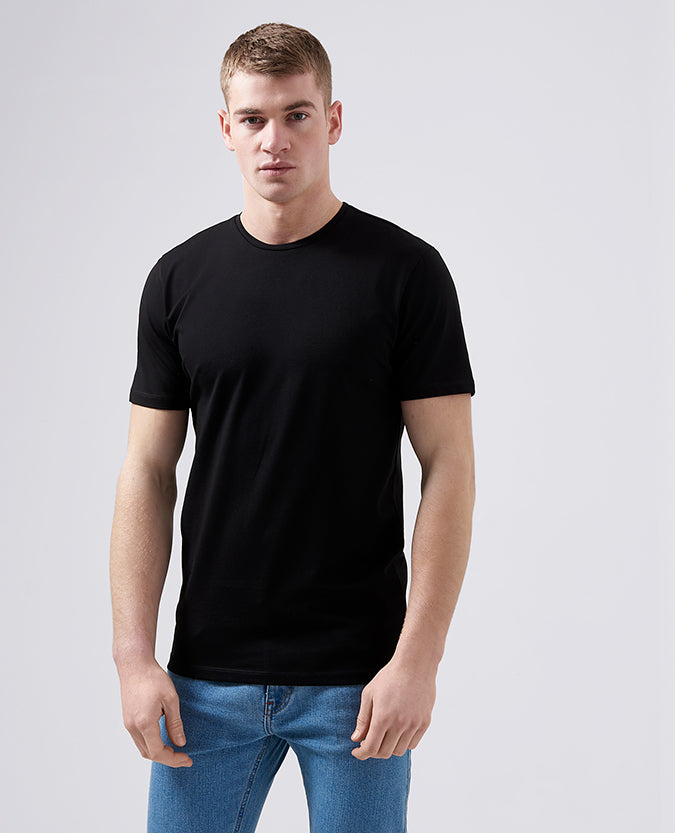 Man wearing a black Tapered Fit Cotton-Stretch T-Shirt