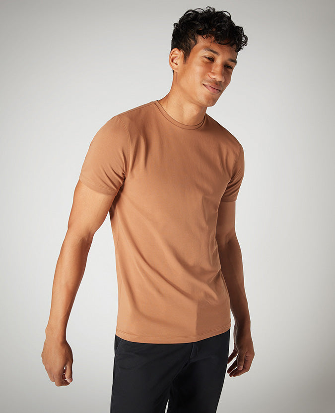 Man wearing a brown Tapered Fit Cotton-Stretch T-Shirt