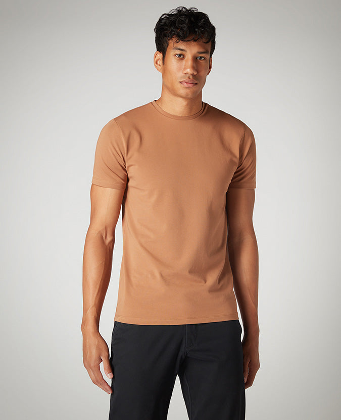 Man wearing a brown Tapered Fit Cotton-Stretch T-Shirt