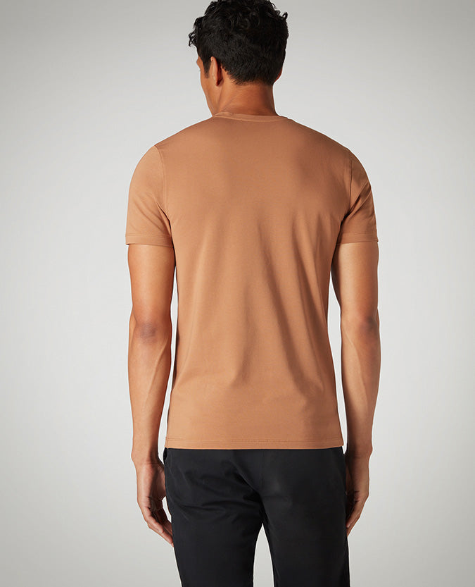 Man wearing a brown Tapered Fit Cotton-Stretch T-Shirt