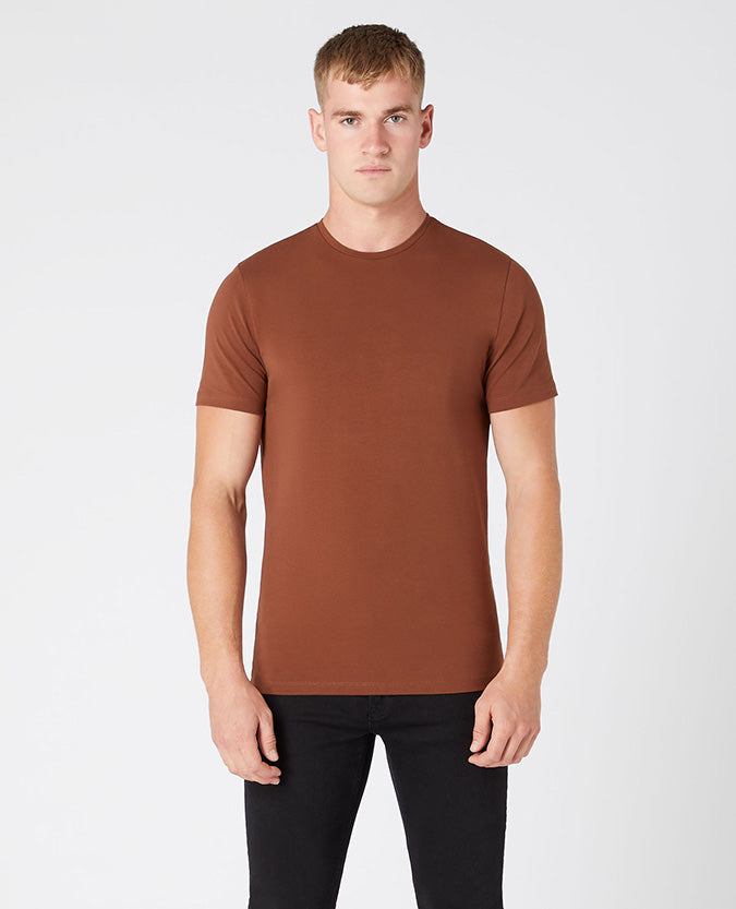 Man wearing a brown Tapered Fit Cotton-Stretch T-Shirt