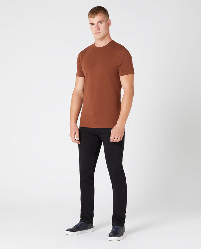 Man wearing a brown Tapered Fit Cotton-Stretch T-Shirt