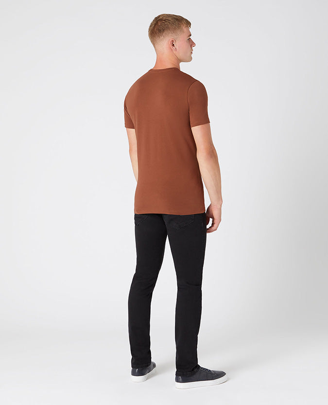 Man wearing a brown Tapered Fit Cotton-Stretch T-Shirt