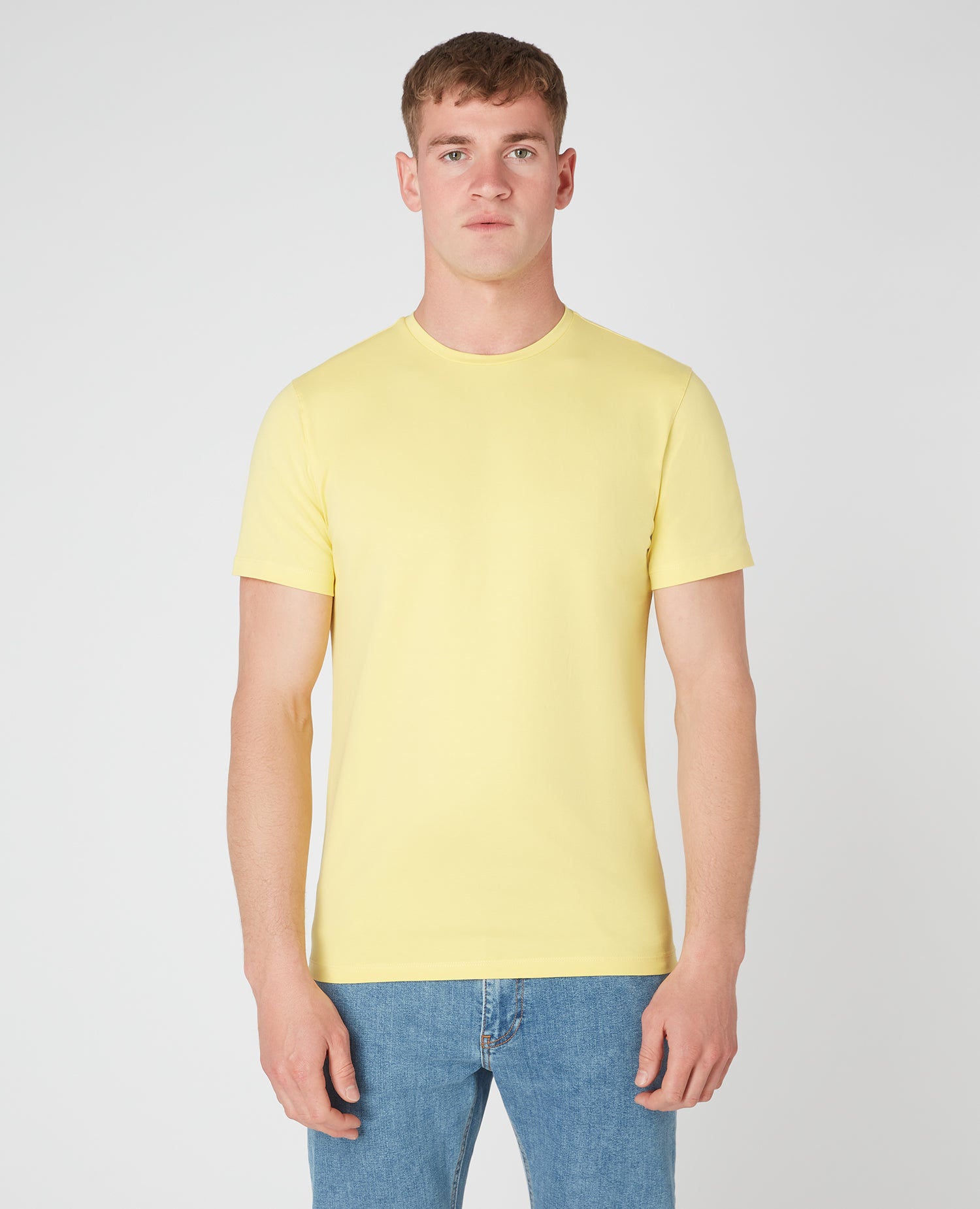 Man wearing a orange Tapered Fit Cotton-Stretch T-Shirt