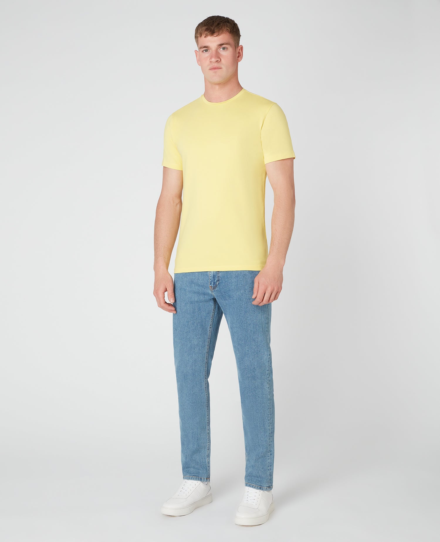 Man wearing a orange Tapered Fit Cotton-Stretch T-Shirt