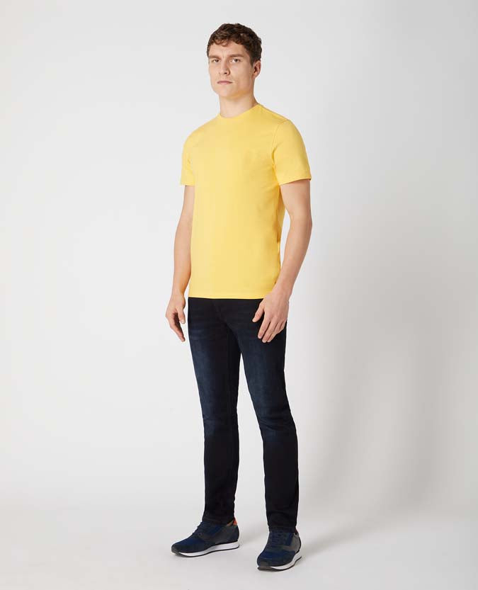 Man wearing a orange Tapered Fit Cotton-Stretch T-Shirt