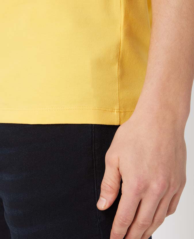 Man wearing a orange Tapered Fit Cotton-Stretch T-Shirt