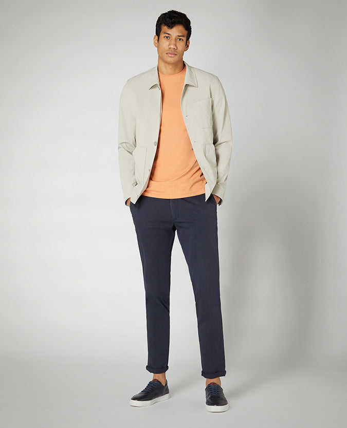 Man wearing a orange Tapered Fit Cotton-Stretch T-Shirt