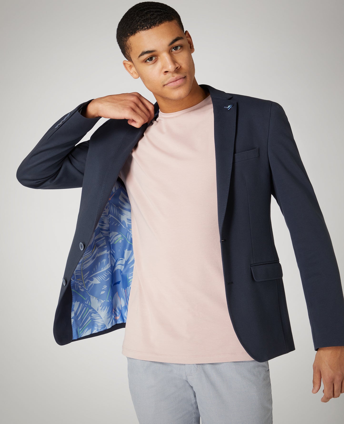 Man wearing a pink Tapered Fit Cotton-Stretch T-Shirt