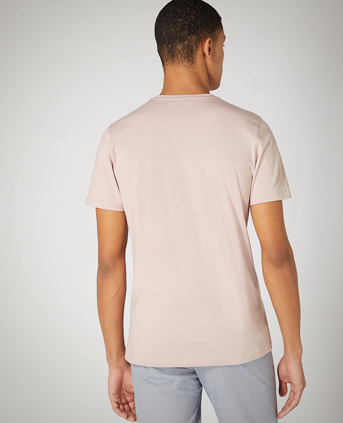 Man wearing a pink Tapered Fit Cotton-Stretch T-Shirt