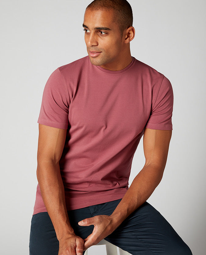 Man wearing a red Tapered Fit Cotton-Stretch T-Shirt