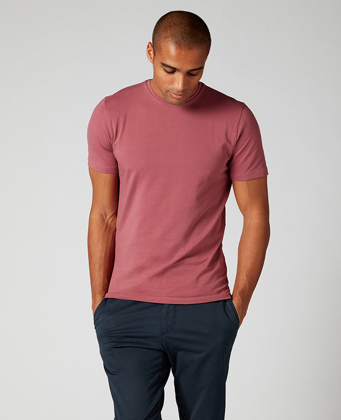 Man wearing a red Tapered Fit Cotton-Stretch T-Shirt