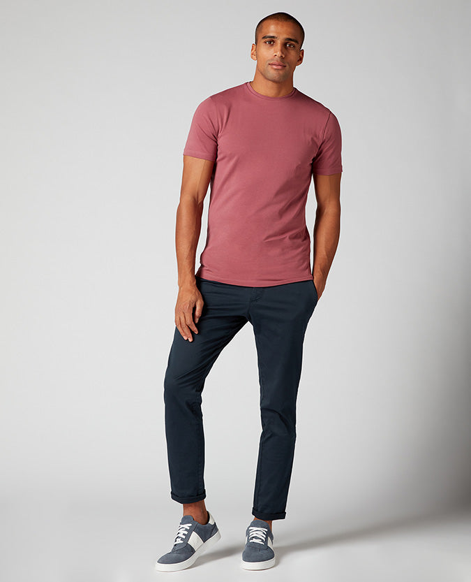 Man wearing a red Tapered Fit Cotton-Stretch T-Shirt