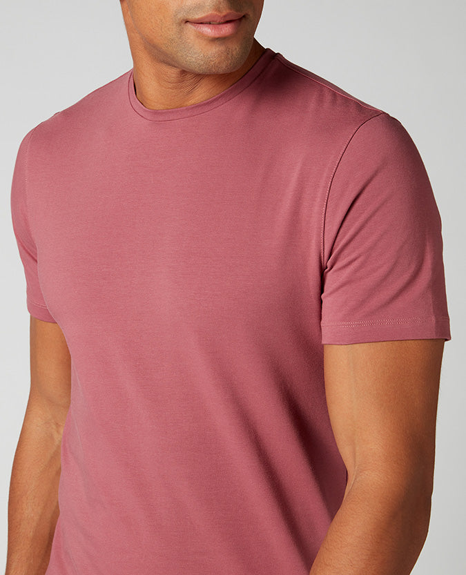 Man wearing a red Tapered Fit Cotton-Stretch T-Shirt
