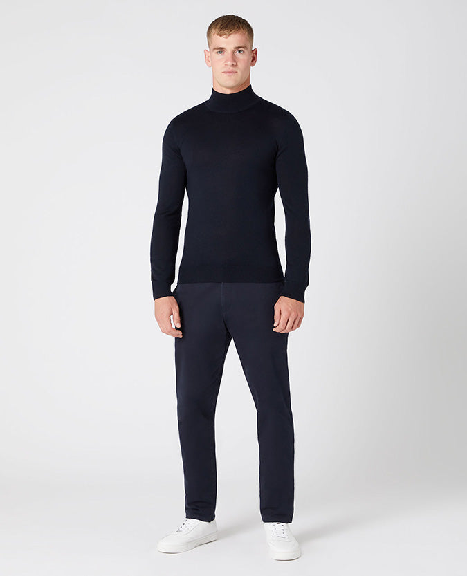 Man wearing a navy Slim Fit Merino Wool-Blend Turtle Neck