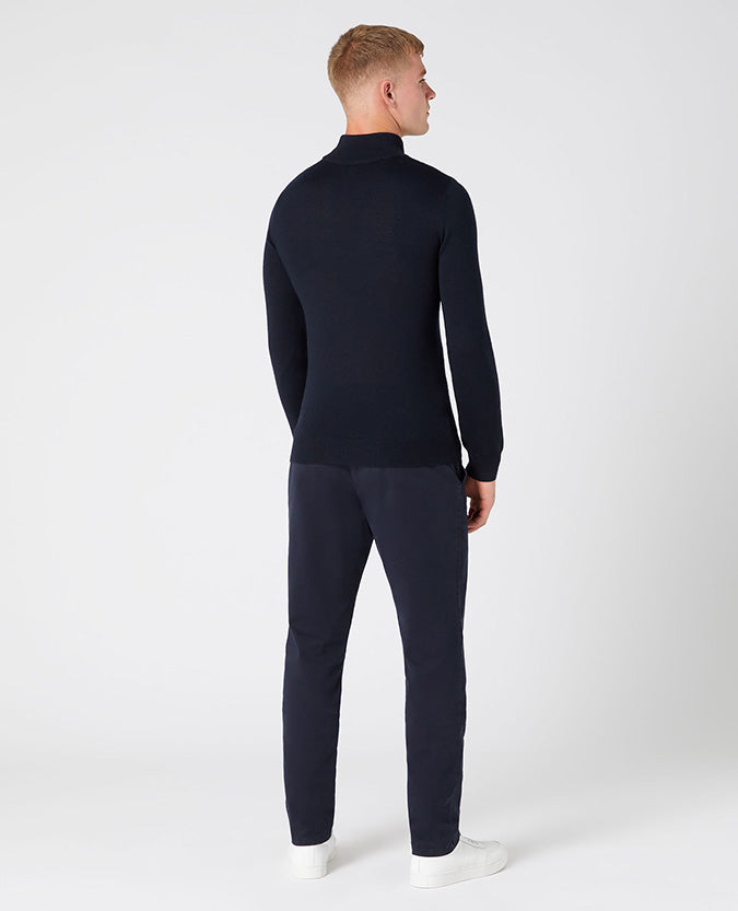 Man wearing a navy Slim Fit Merino Wool-Blend Turtle Neck
