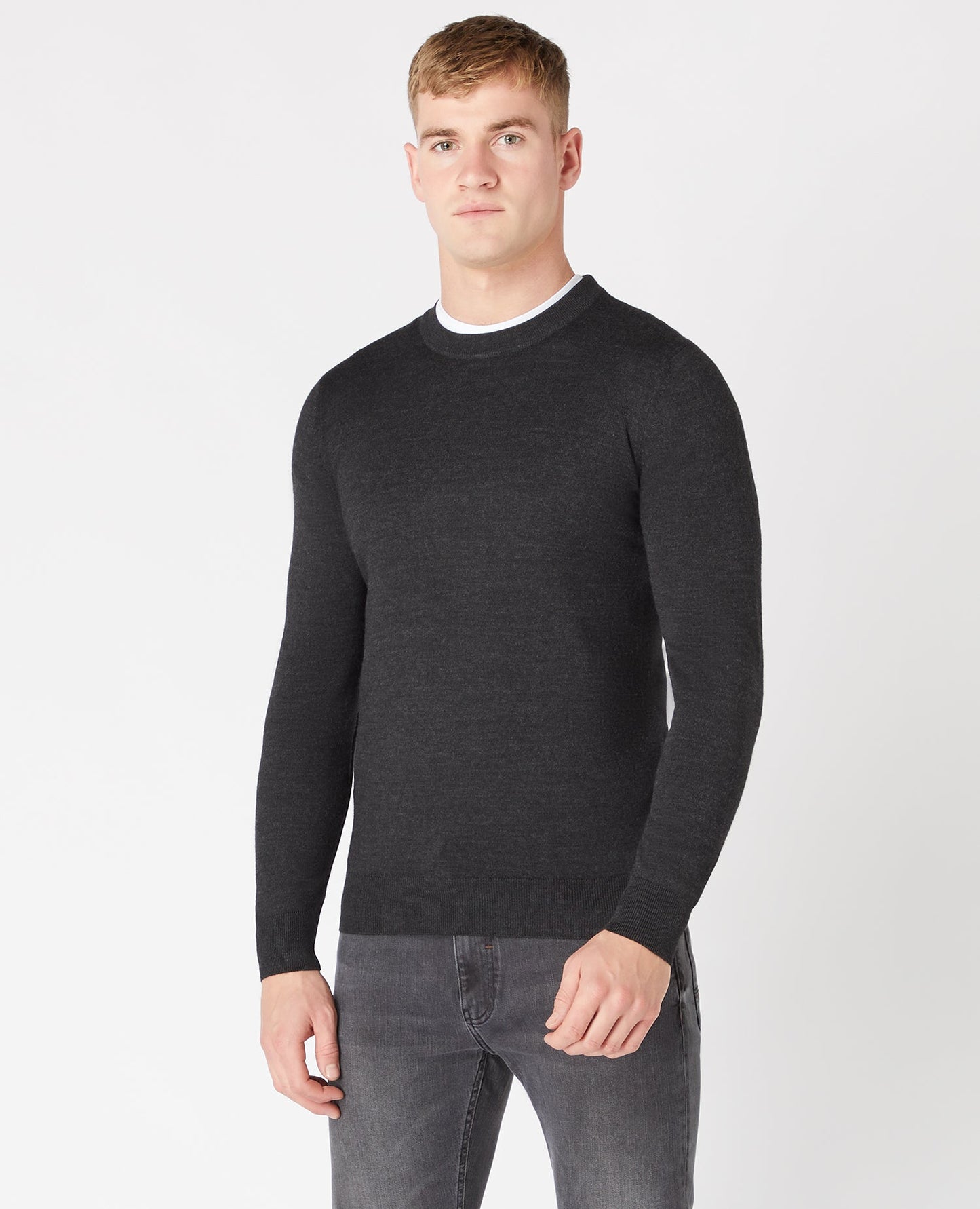 Man wearing a grey Tapered Fit Merino Wool-Blend Crew Neck Sweater