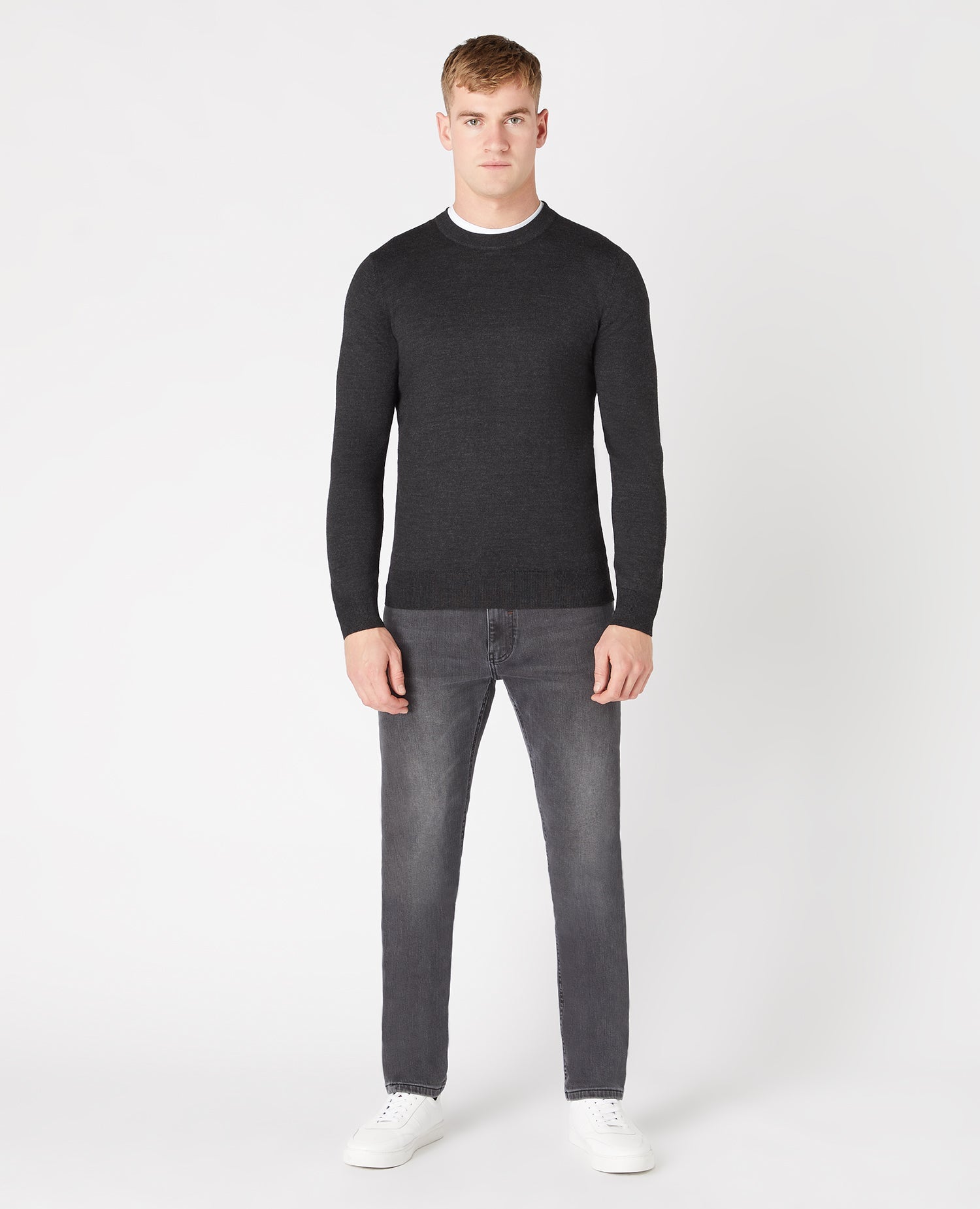 Man wearing a grey Tapered Fit Merino Wool-Blend Crew Neck Sweater