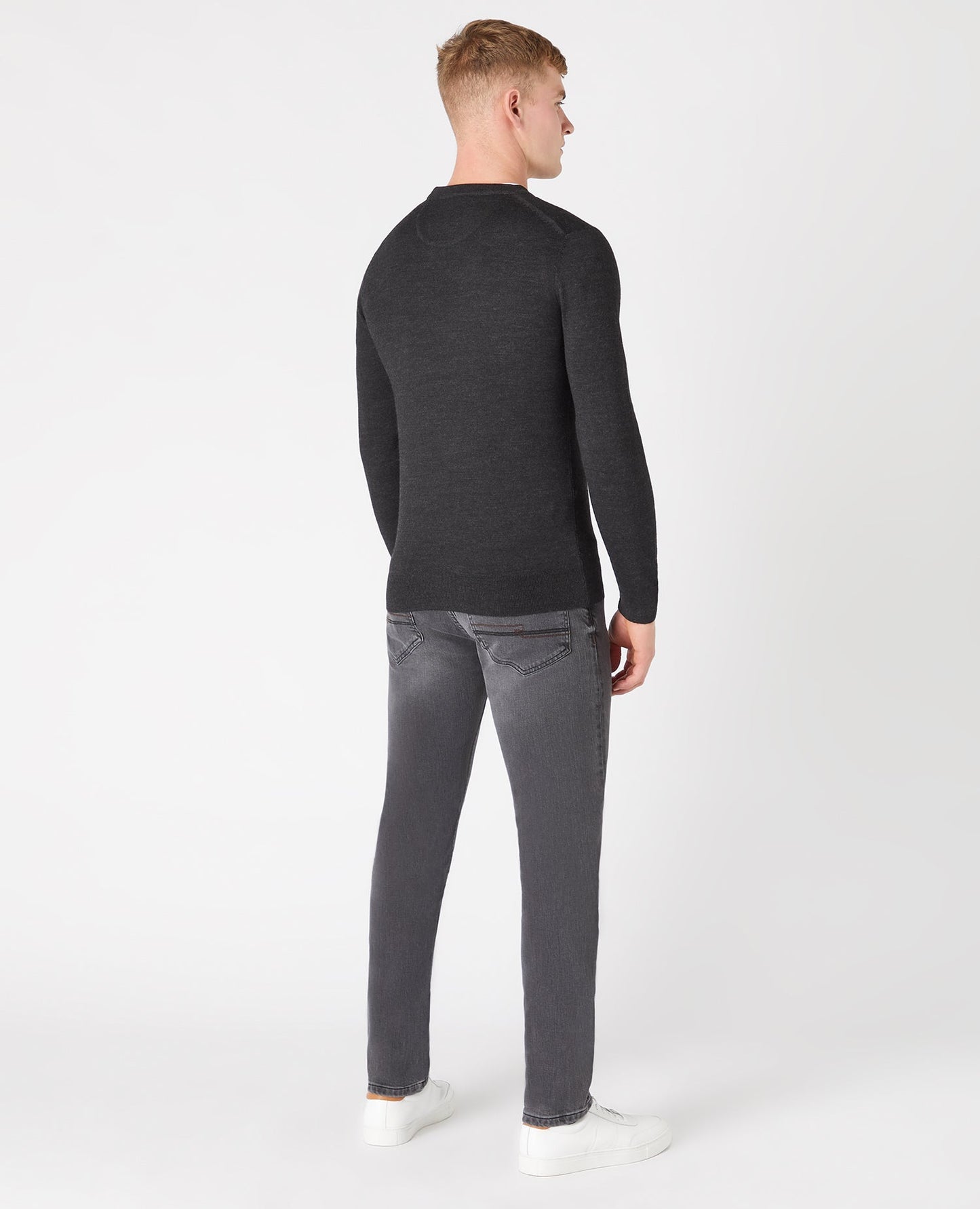 Man wearing a grey Tapered Fit Merino Wool-Blend Crew Neck Sweater