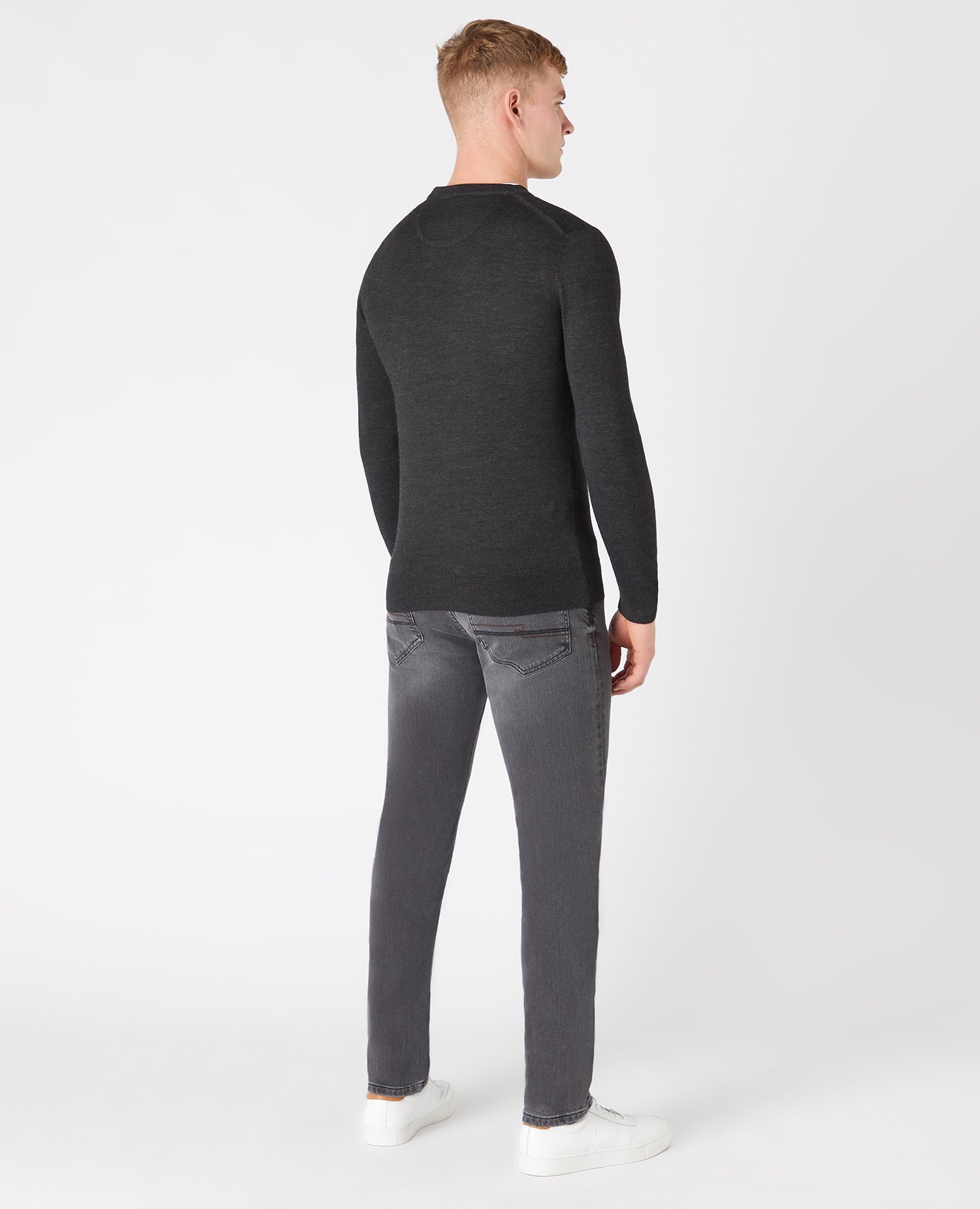 Man wearing a grey Tapered Fit Merino Wool-Blend Crew Neck Sweater