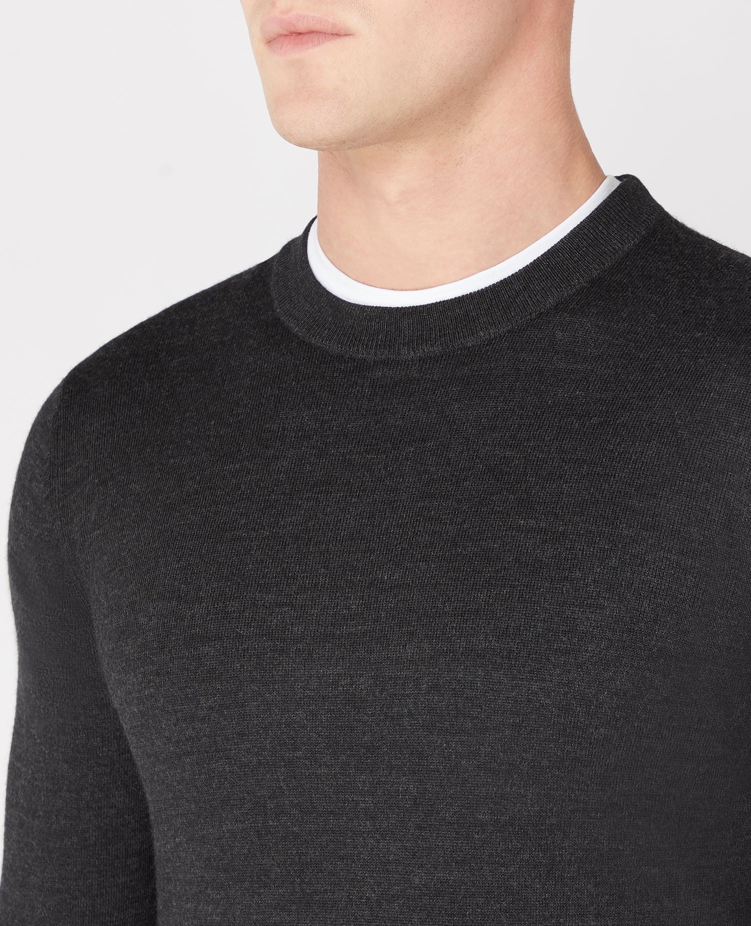 Man wearing a grey Tapered Fit Merino Wool-Blend Crew Neck Sweater