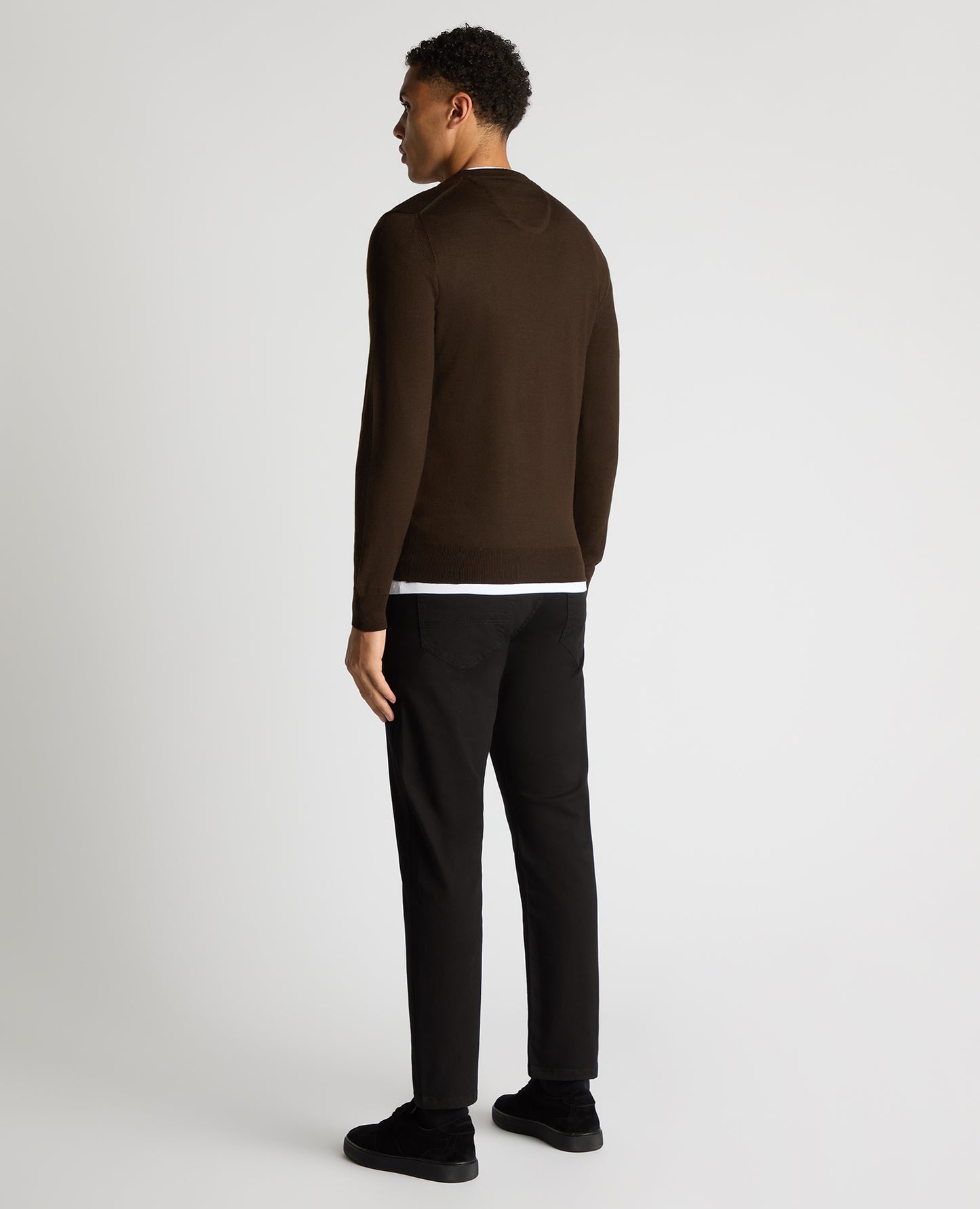 Man wearing a brown Tapered Fit Merino Wool-Blend Crew Neck Sweater