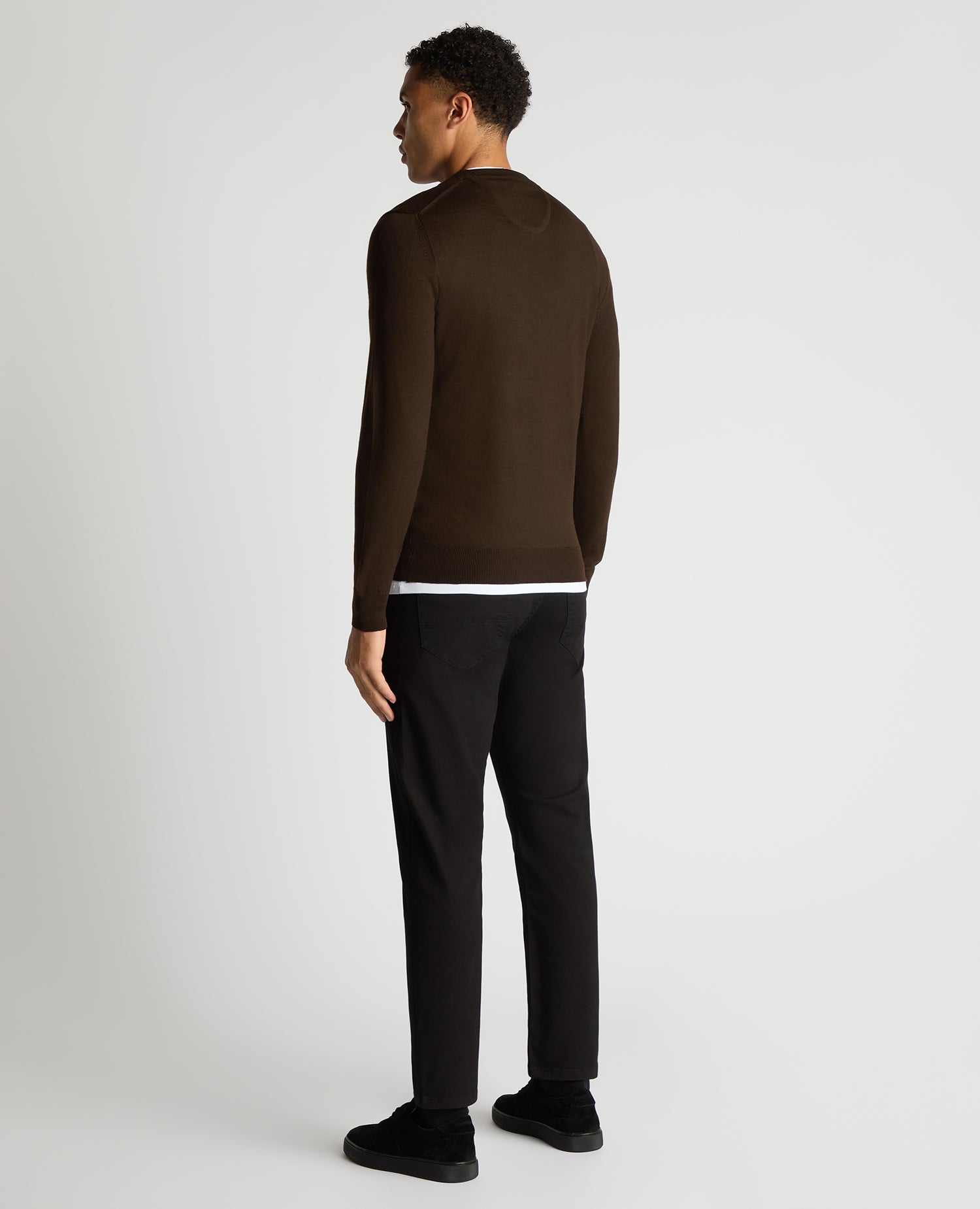 Man wearing a brown Tapered Fit Merino Wool-Blend Crew Neck Sweater
