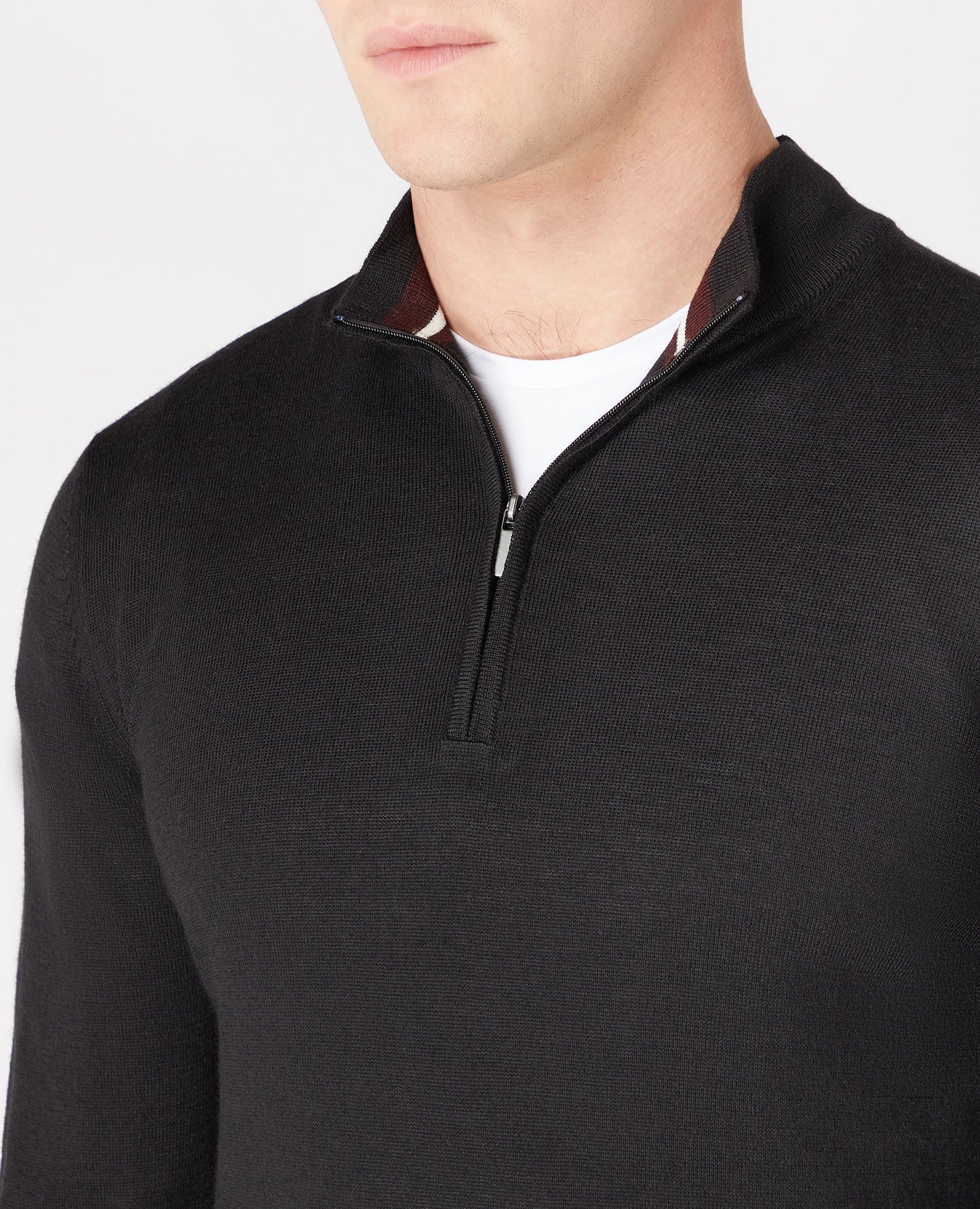 Man wearing a black Tapered Fit Merino Wool-Blend Half Zip Sweater