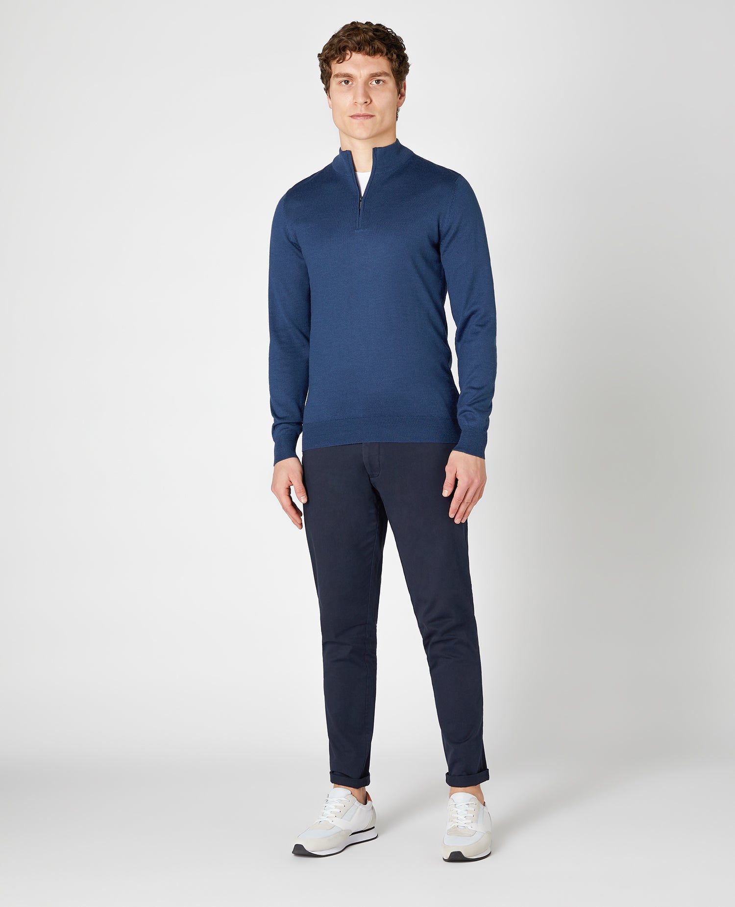 Man wearing a blue Tapered fit Merino Wool- Blend Half Zip Sweater