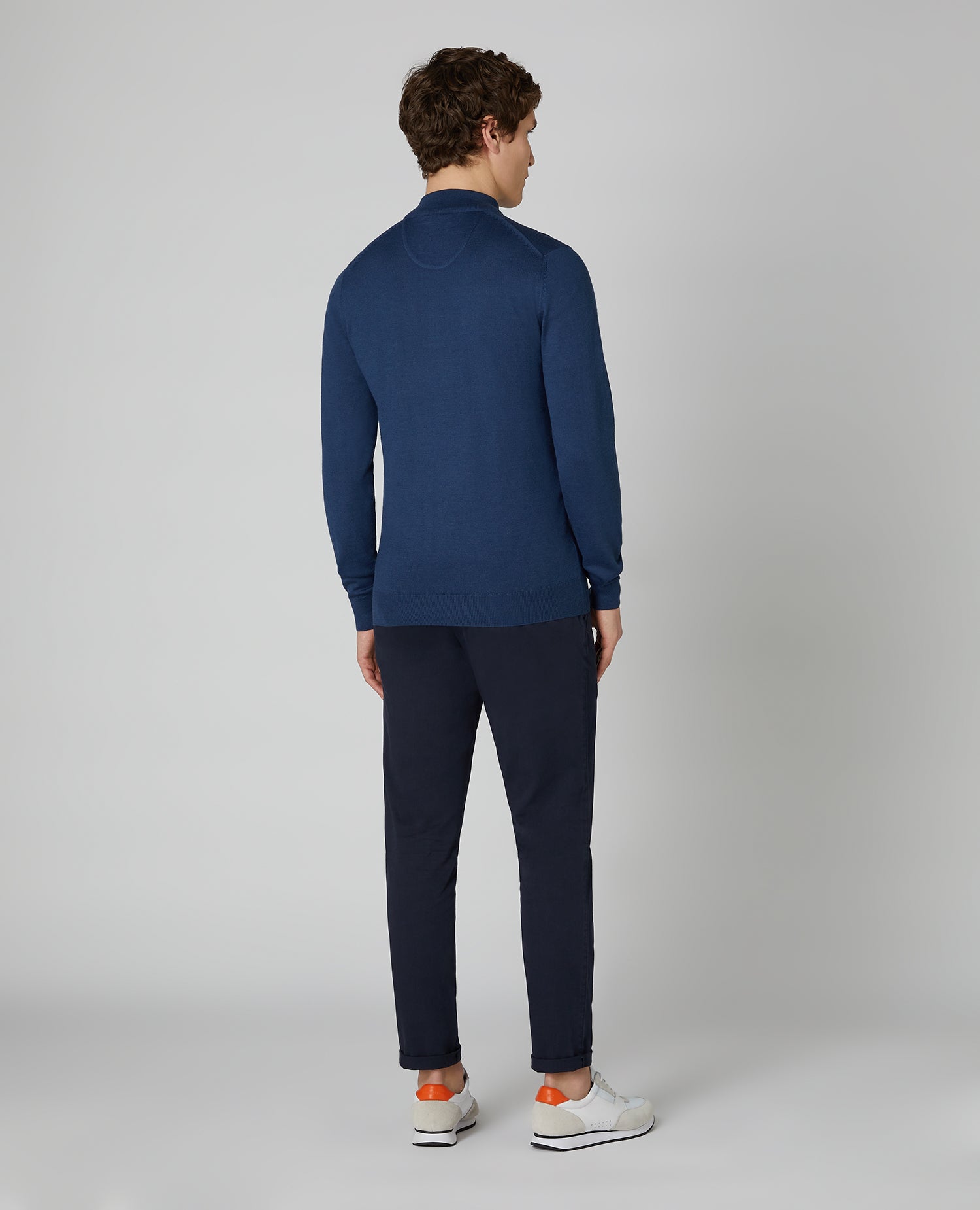 Man wearing a blue Tapered fit Merino Wool- Blend Half Zip Sweater